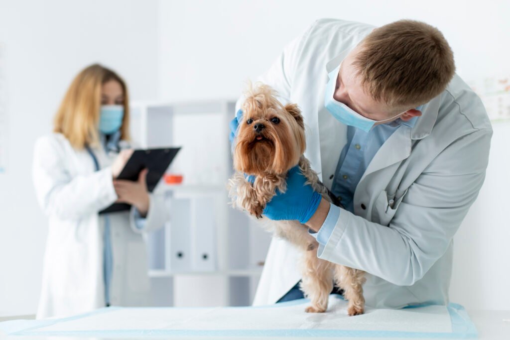 a man in a white coat holding a small dog